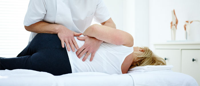 chiropractor adjusting a patient