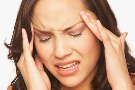Close up of lady with headache